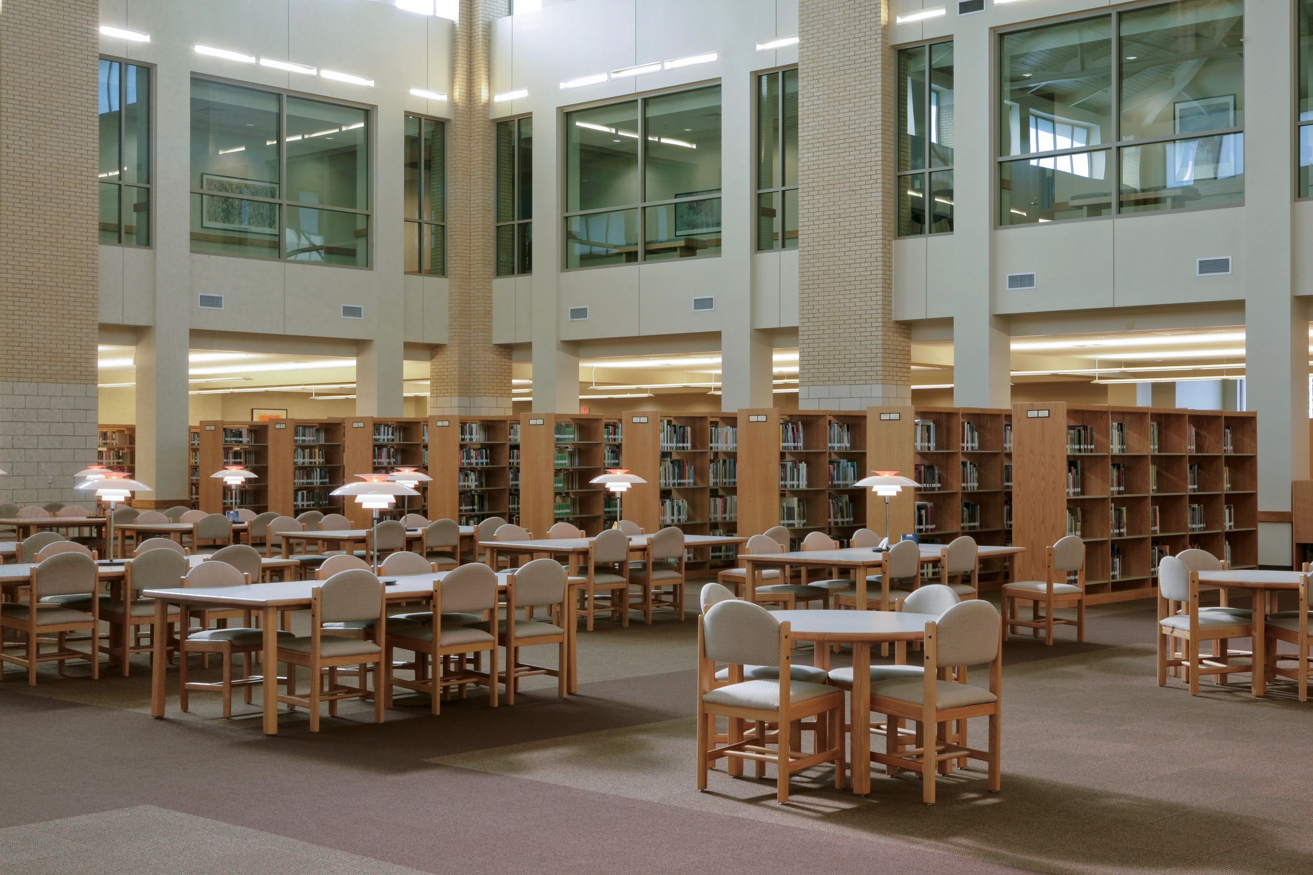 Quiet academic library interior for Qur'anic research and study